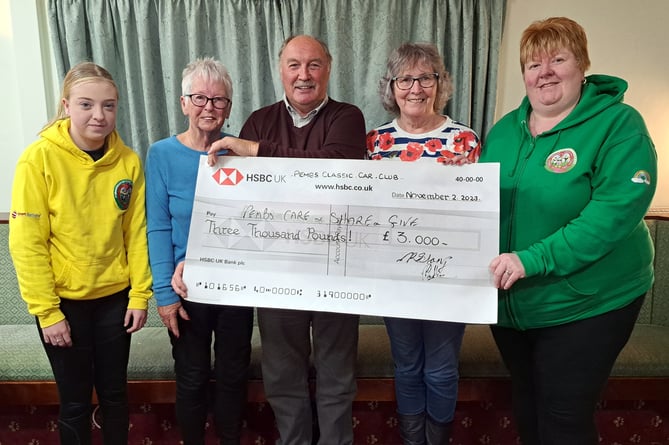 Club Treasurer Nick Stamp presenting a donation to Amanda Absalom-Lowe, Sandi Davis, Rita Gowing and Megan Absalom-Lowe of Pembrokeshire Care, Share & GIve.