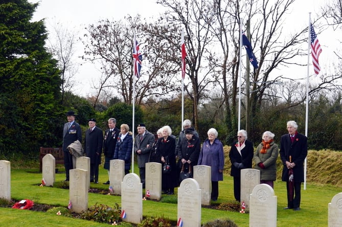 Members of the Cresselly and District Branch of The Royal British Legion paying their respects at the war graves plot at Carew Cheriton cemetery.