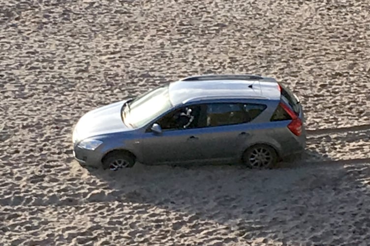 Car on castle beach