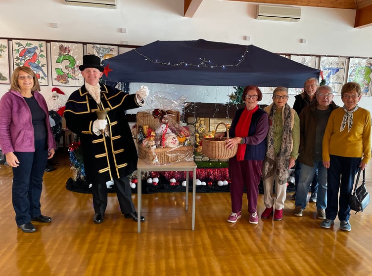 In the photograph with the Town Crier are Society Committee members (left to right) Linda Asman, June Willcocks, Sue Clague, Stuart Asman, Mary Willington and Vicki Haggar.