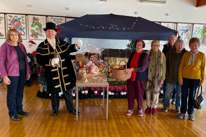 In the photograph with the Town Crier are Society Committee members (left to right) Linda Asman, June Willcocks, Sue Clague, Stuart Asman, Mary Willington and Vicki Haggar.