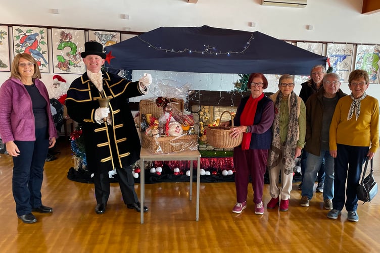 In the photograph with the Town Crier are Society Committee members (left to right) Linda Asman, June Willcocks, Sue Clague, Stuart Asman, Mary Willington and Vicki Haggar.