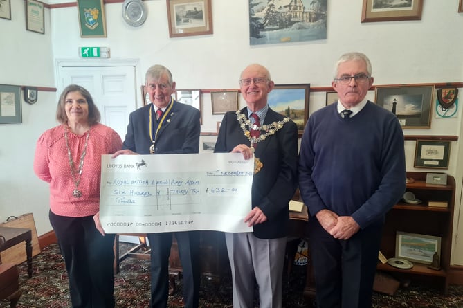 Mayor of Pembroke Cllr Aden Brinn presenting the donation to Royal British Legion District Chairman Mr Tom Brown. Also in the photo is the Mayoress Mrs Claire Dunfresnoy and Royal British Legion District Treasurer Mr John Mycroft.