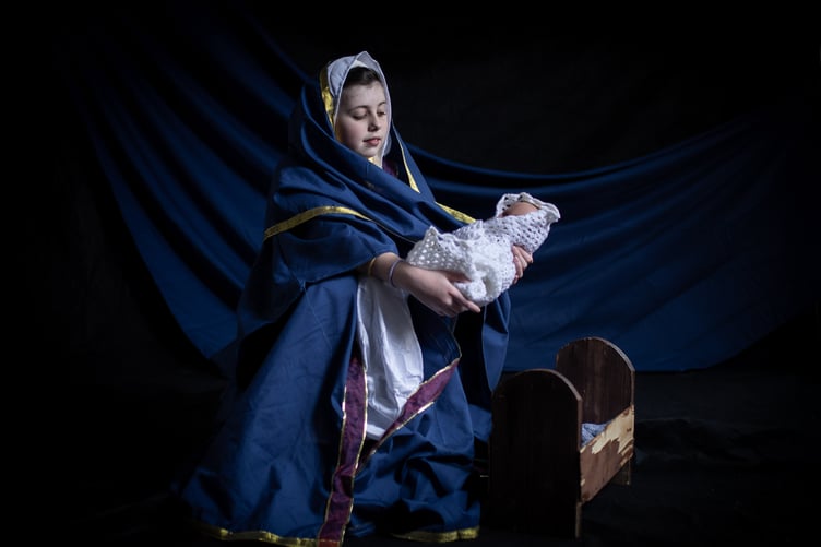 Pupils from St Teiloâs Catholic Primary School, located in the popular seaside resort of Tenby, act out scenes from their nativity plays before they break for Christmas on Friday. All schools will have finally broken up for the Christmas holidays by either today or tomorrow. In the image, Isabella Fairile, 11, plays Mary whilst holding baby Jesus next to his manger.