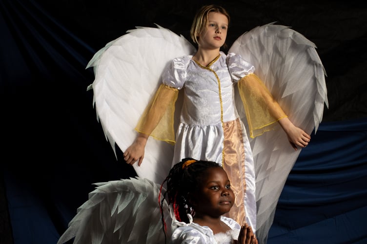 Pupils from St Teiloâs Catholic Primary School, located in the popular seaside resort of Tenby, act out scenes from their nativity plays before they break for Christmas on Friday. All schools will have finally broken up for the Christmas holidays by either today or tomorrow. In the image, two angels, Kimberly Mavindidze (left) and Hazel Monan (right) from Class 3 show off their wings.