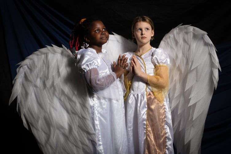Pupils from St Teiloâs Catholic Primary School, located in the popular seaside resort of Tenby, act out scenes from their nativity plays before they break for Christmas on Friday. All schools will have finally broken up for the Christmas holidays by either today or tomorrow. In the image, two angels, Kimberly Mavindidze (left) and Hazel Monan (right) from Class 3 show off their wings.