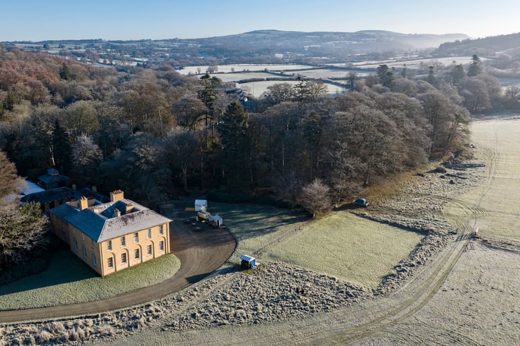 Aerial view of the Georgian villa within the frosty landscape at Christmas time at Llanerchaeron, Ceredigion