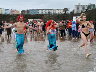 Watch as 100s take to the sea for Tenby's Boxing Day Charity Swim