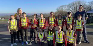 Pembrokeshire opticians makes high-vis vest donation to local school
