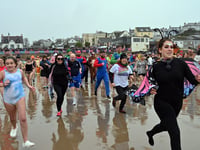 Thousands take to the sea in Saundersfoot for the New Year's Day Swim