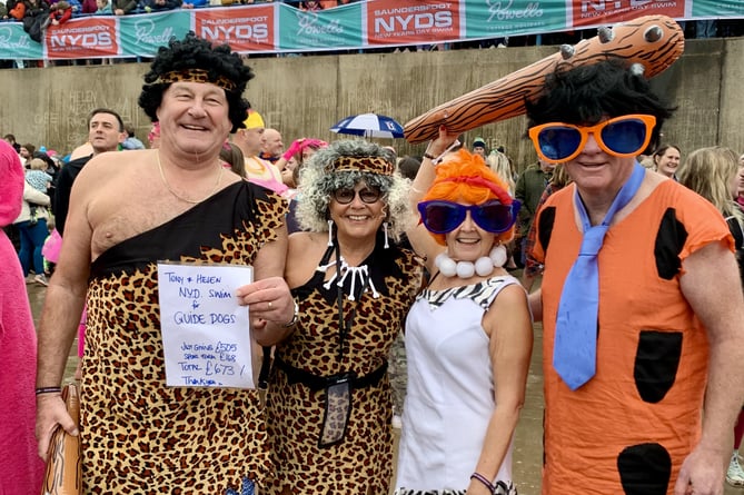‘Cavemen‘ Helen and Tony Hedley and friends at the New Year’s Day Swim in Saundersfoot.