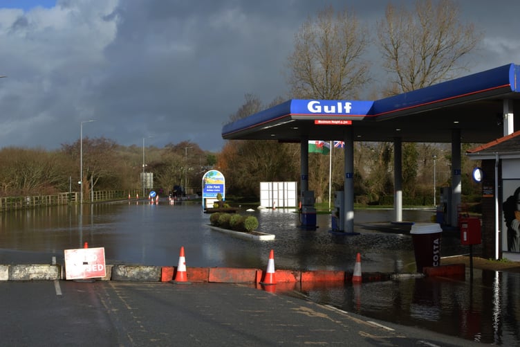 flooding by Kiln Park Service Station