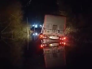 WATCH: lorry gets stuck in ditch trying to get around Tenby floods