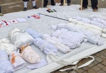 WATCH: Pro-Palestine demonstrators stage mock funeral in Haverfordwest