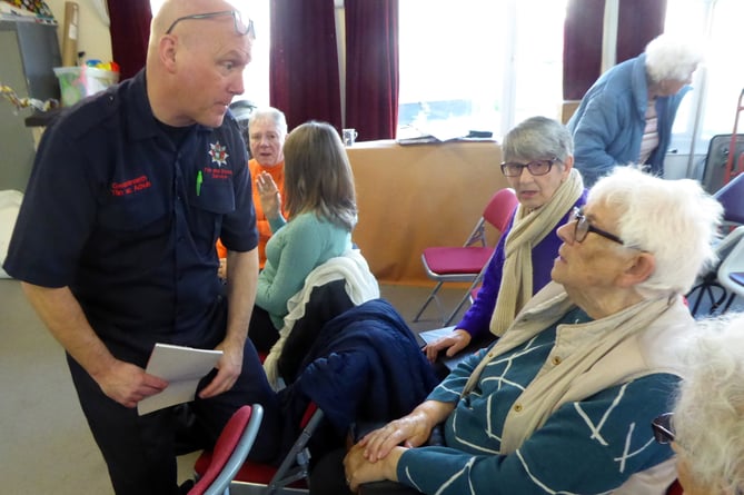 Lee Simmons of the Tenby Fire Brigade with Friendship Club member Gertie. 