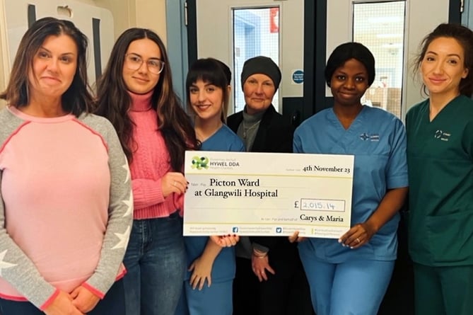 Carys and Maria cheque presentation for Glangwili Hospital