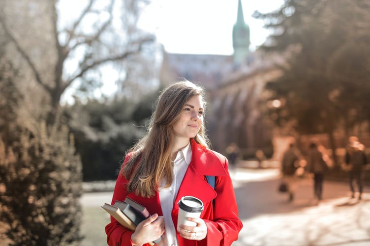 Student with books and coffee