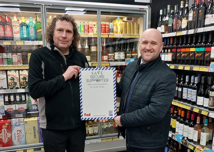 Police and Crime Commissioner Dafydd Llywelyn with Tenby Stores manager Vince Malone.