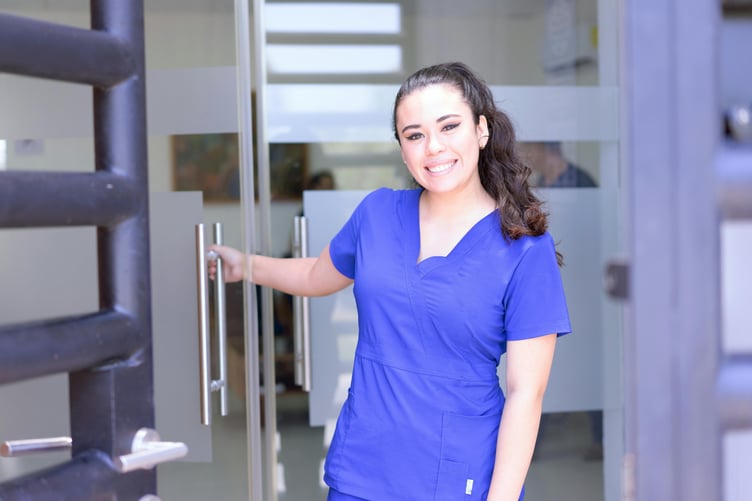 Woman in blue scrubs / nurse / healthcare