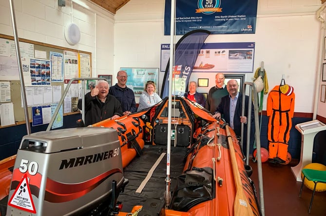 Cefin Campbell MS (right) with RNLI volunteer crew members at Borth lifeboat station, north Ceredigion.
