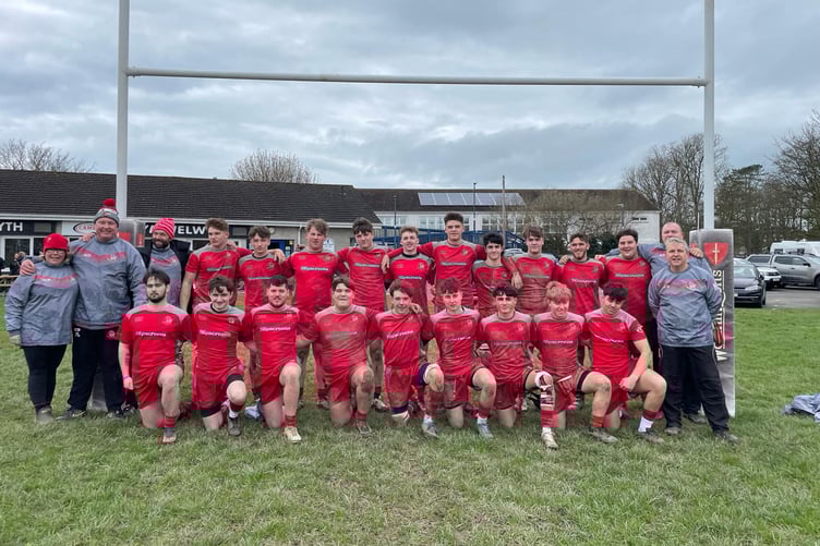 Pembroke Youths' league-winning squad and coaching group