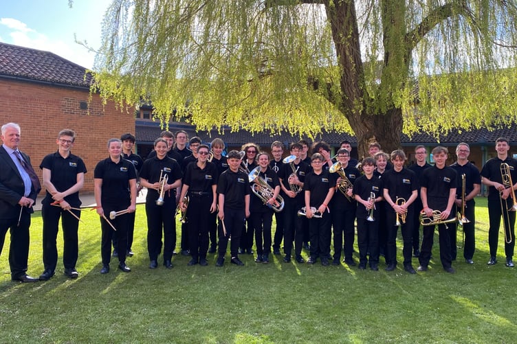 Pembrokeshire Music Service Youth Brass Band with their conductor Ian Wilkinson