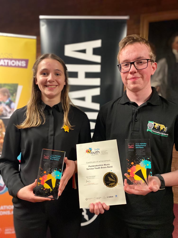 Best soloist recipient Carys and Brass Band member Filip collecting the awards