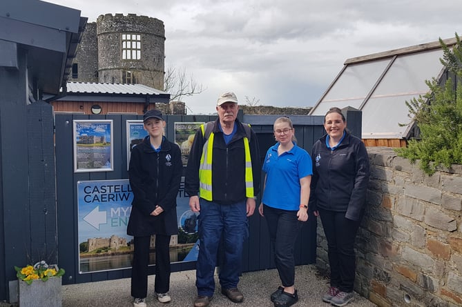 Peter Kraus with staff at the Nest Café at Carew Castle, the mid-point of his 15.6-mile walking challenge for veterans charity Combat Stress.
