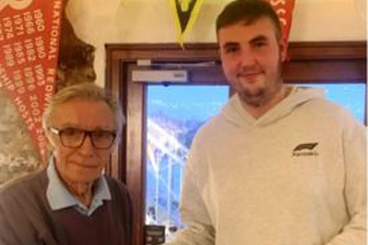 Blake Shaw receives a £100 cheque from Joseph Fry