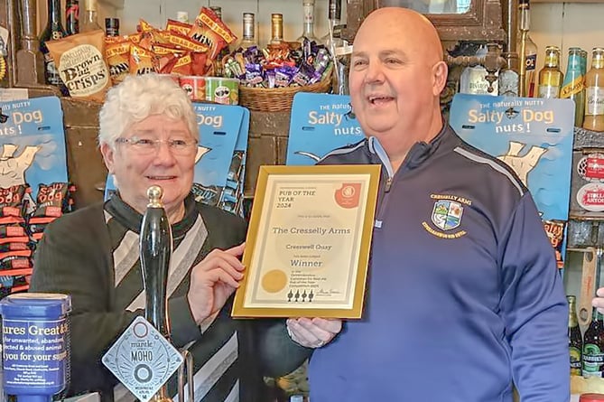 Pembrokeshire CAMRA chair Alwen Thomas presents Cresselly Arms landlord Steve Adams with his ‘Pub of the Year’ certificate.