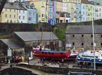 WATCH: Tenby's boats get a helping hand back into the harbour waters