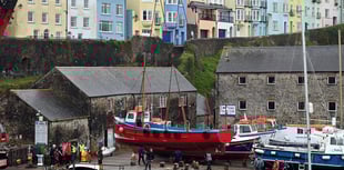 WATCH: Tenby's boats get a helping hand back into the harbour waters