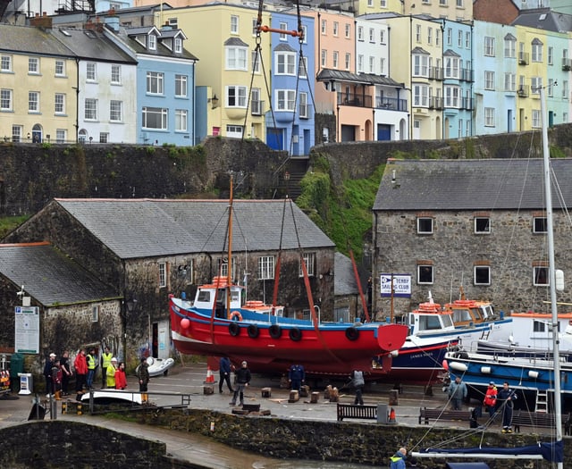 WATCH: Tenby's boats get a helping hand back into the harbour waters