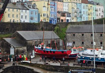 WATCH: Tenby's boats get a helping hand back into the harbour waters