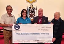 Tenby Freemasons donate to Paul Sartori charity in memory of well-known local