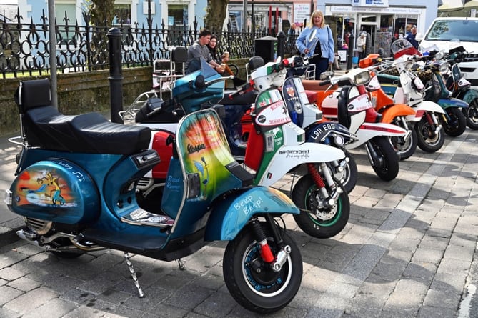 Colourful scooters parked up in Tenby High Street