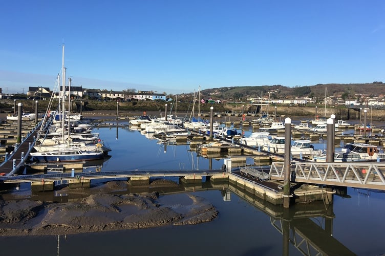 Boats at Burry Port harbour at low tide