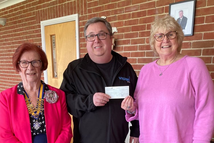 Drew Baker of The Vision Theatre Company accepting a donation from Dot Edwards and President of Inner Wheel of Pembroke June Willcocks