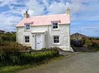 Look inside this pastel cottage for sale with "superb" coastal views 