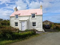Look inside this pastel cottage for sale with "superb" coastal views 
