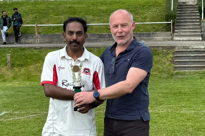WWCCC sponsor Nigel Salmon of Fine and Country congratulates Phillip Abraham of Talybont/Rachels on being the leading bowler in the 2023 competition