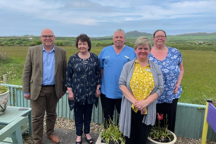 Paul Davies MS is pictured with representatives from Shalom House.