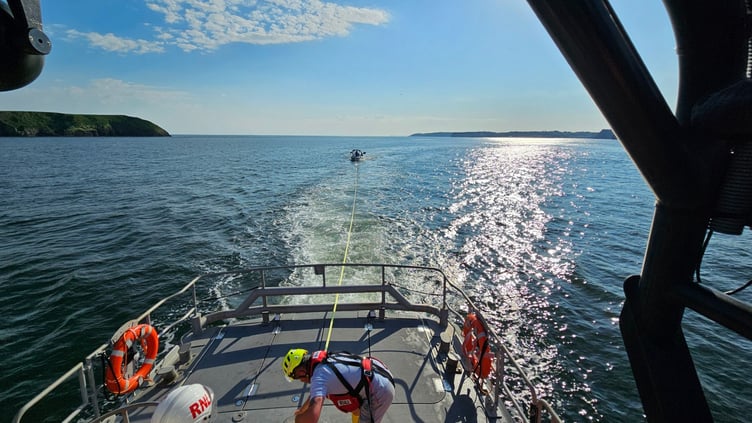 RNLI rescuing speedboat