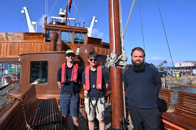 Tenby's harbourmasters pictured aboard the Waverley with a crew member on its return to the picturesque Pembrokeshire harbour setting.