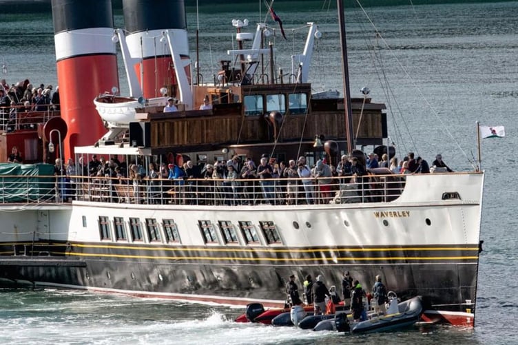 The Rhibs help manoeuvre the Waverley on her departure from Tenby