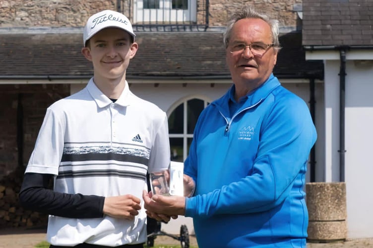 Guto Walters being presented with his trophy and prize