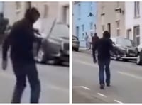 Hooded man seen sinisterly wielding 'machete' on Pembroke Dock street