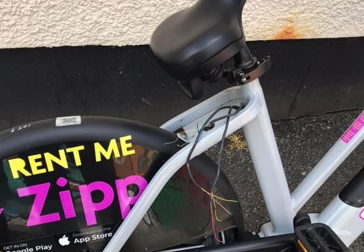 broken E-bike pictured on a random street
