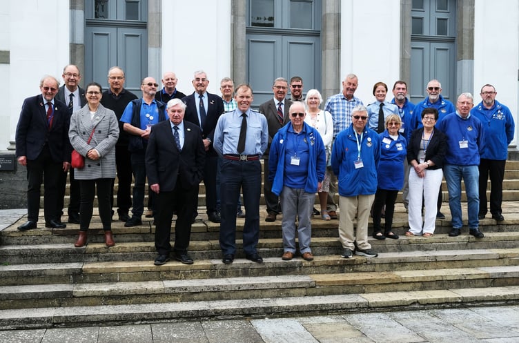 Air Commodore Rob Woods, Air Officer Wales, on his first official visit to the county, pictured on the steps of Pembroke Dock Heritage Centre with members of the Centre team and representatives of county organisations involved in aviation heritage.