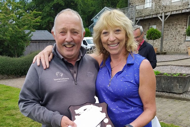 Meurig Evans accepting the Past Captains’ Trophy, from Rosie Sweet